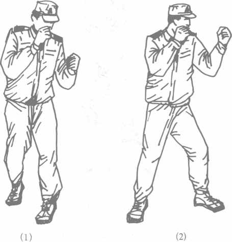 右勾拳同左勾拳,方向相反(图1-30 要求:转体带拳勾击迅猛,发力短促.
